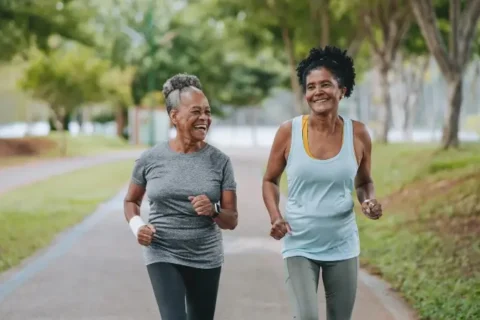 Two women exercise together to manage their heart disease in Sugar Land, TX